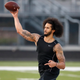 Exiled quarteback Colin Kaepernick hosted his own workout for NFL football scouts and media Nov. 16, 2019, at Charles R. Drew High School in Riverdale, Ga.